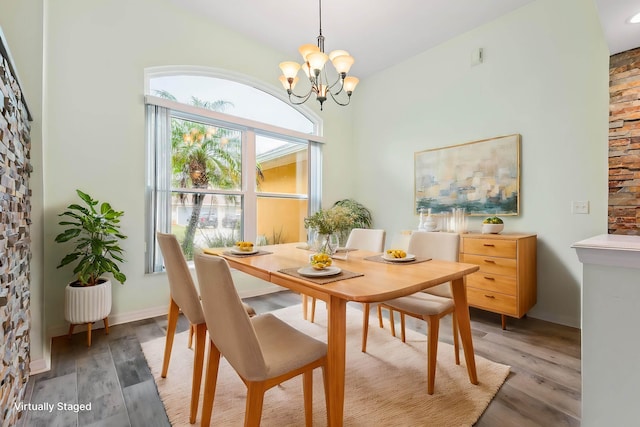 4 Eastgate Ln, Palm Coast, FL 32164 - dining room featuring a chandelier and light wood-style flooring