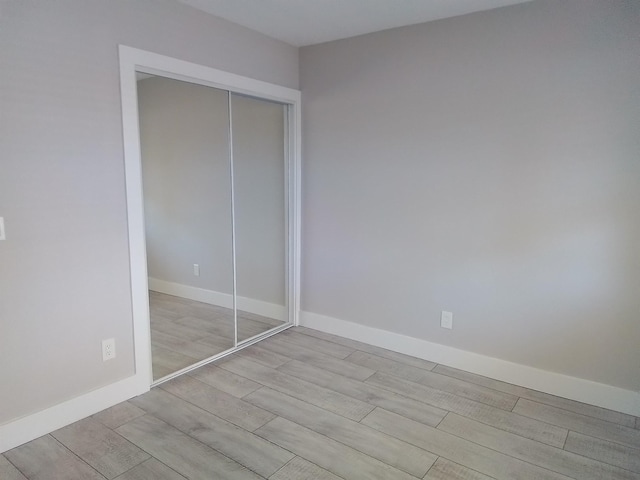 unfurnished bedroom featuring a closet