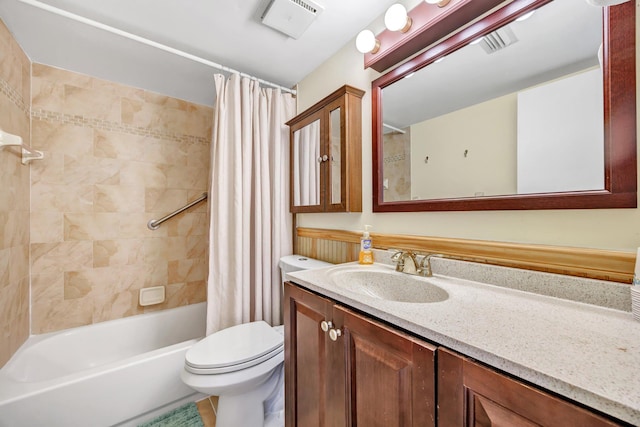 full bathroom with vanity, toilet, and shower / bath combo with shower curtain