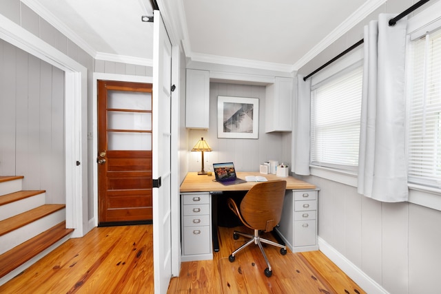 6 E Park Ave, Saint Augustine, FL 32084 - home office with light wood-style flooring, ornamental molding, and built in study area