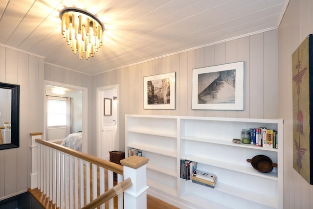 6 E Park Ave, Saint Augustine, FL 32084 - hall featuring ornamental molding, an upstairs landing, a chandelier, and wood ceiling