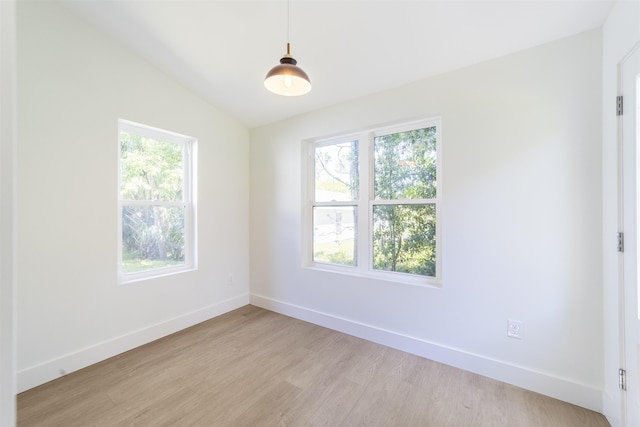 962 Alexander St, Saint Augustine, FL 32084 - spare room featuring light wood-type flooring and lofted ceiling
