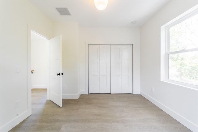962 Alexander St, Saint Augustine, FL 32084 - unfurnished bedroom with light wood-style floors and a closet
