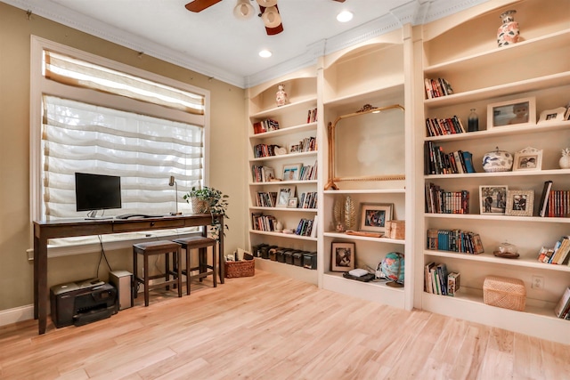 office area with hardwood / wood-style flooring, ceiling fan, built in features, and crown molding