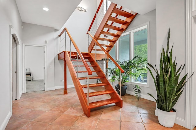 staircase with a wealth of natural light