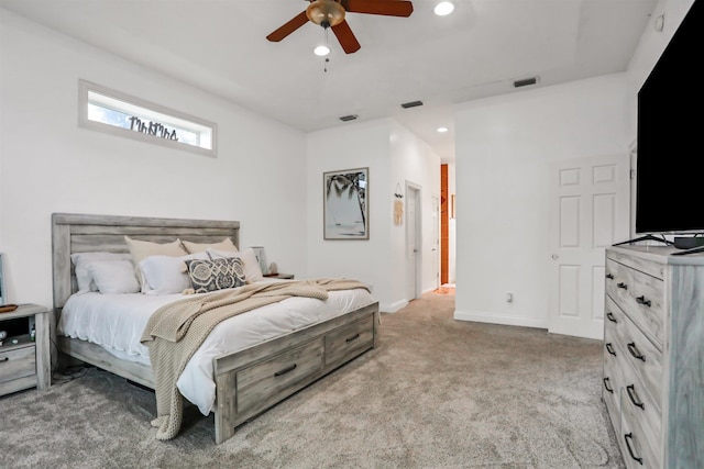 bedroom featuring ceiling fan and light carpet