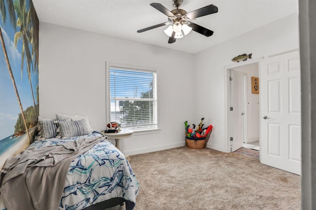 bedroom featuring light colored carpet and ceiling fan