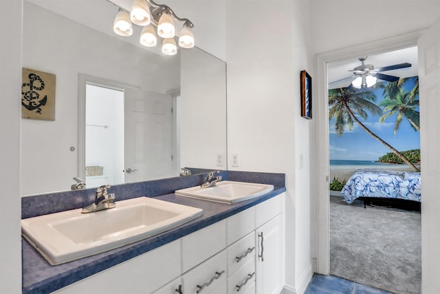 bathroom featuring ceiling fan and vanity