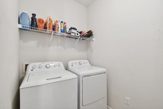 laundry room with separate washer and dryer