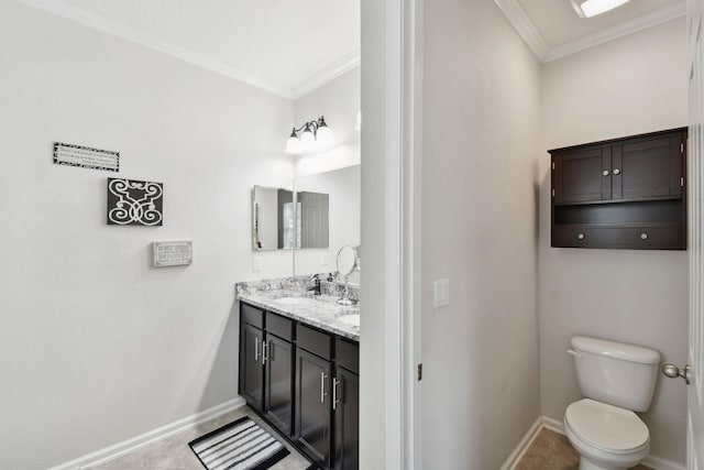 bathroom featuring crown molding, vanity, and toilet