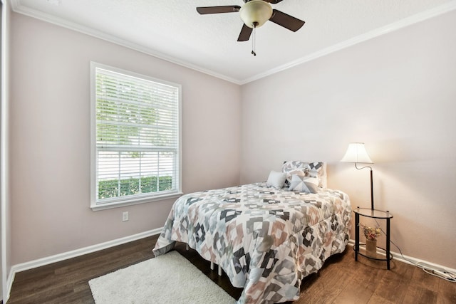 bedroom featuring crown molding, ceiling fan, and dark wood-type flooring