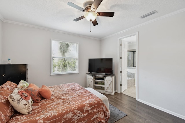 bedroom with ceiling fan, ornamental molding, a textured ceiling, connected bathroom, and dark hardwood / wood-style flooring