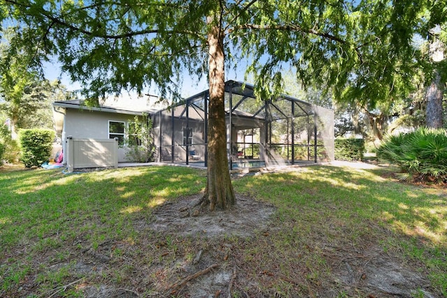 view of yard with a lanai