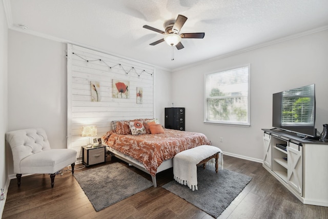 bedroom with dark hardwood / wood-style floors, ceiling fan, and ornamental molding