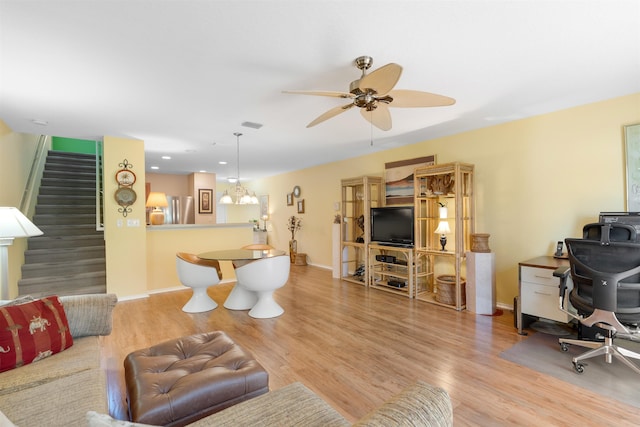 662 Cabernet Pl, Saint Augustine, FL 32084 - living room with stairs, a ceiling fan, wood finished floors, and baseboards