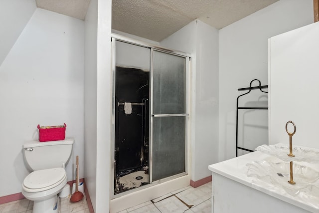 bathroom featuring tile patterned floors, a textured ceiling, toilet, and an enclosed shower