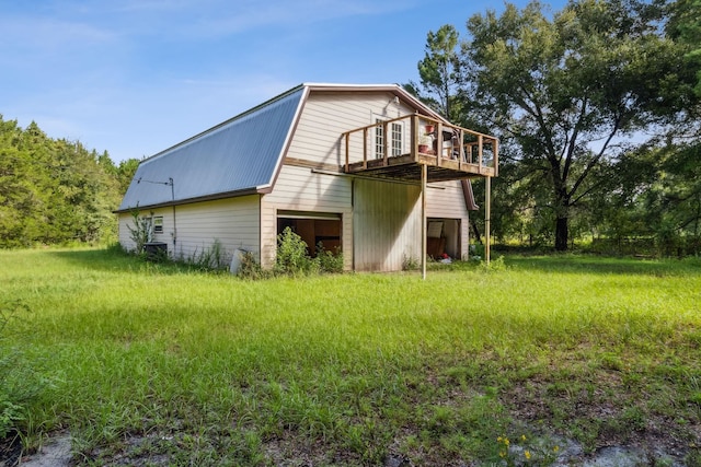 rear view of property with a wooden deck