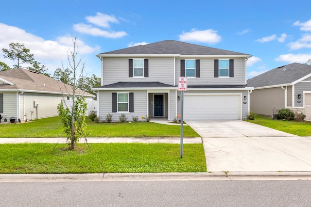 view of front property with a front lawn and a garage