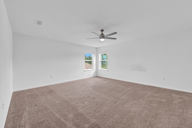 carpeted empty room with ceiling fan