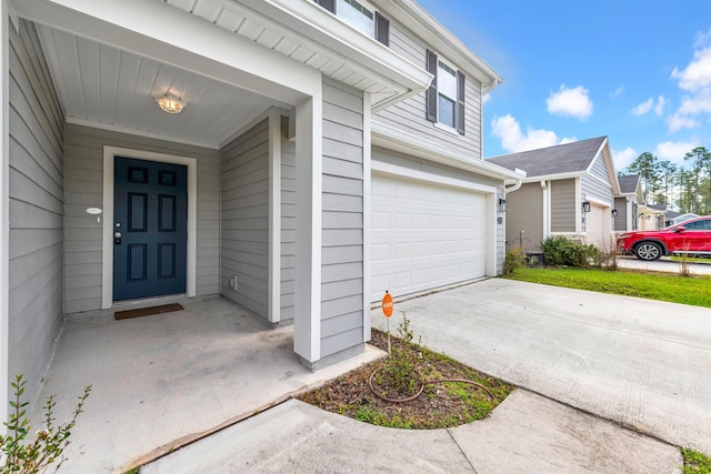 property entrance with a garage