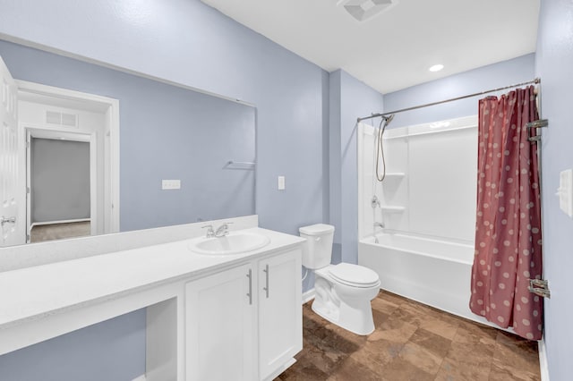 full bathroom featuring vanity, toilet, and shower / tub combo