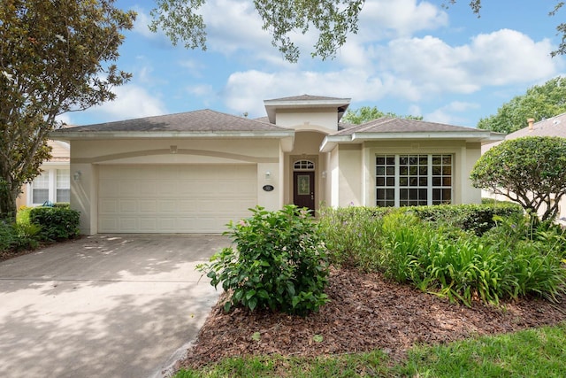 902 Heron Point Cir, Deland, FL 32724 - view of front of property featuring an attached garage, stucco siding, and concrete driveway