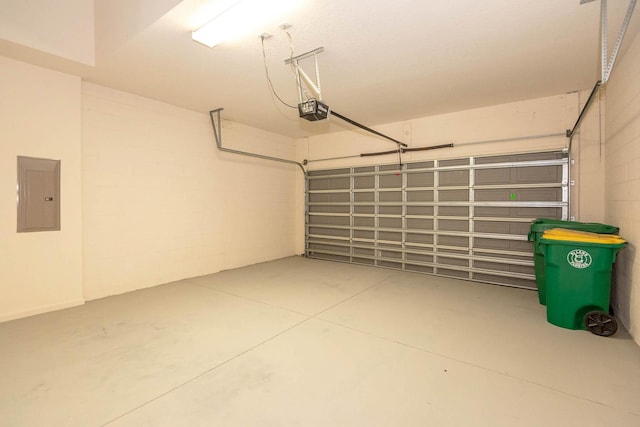 902 Heron Point Cir, Deland, FL 32724 - garage featuring electric panel, a garage door opener, and concrete block wall