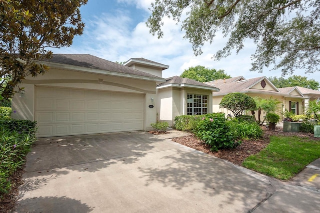 902 Heron Point Cir, Deland, FL 32724 - view of front of property featuring concrete driveway, stucco siding, and a garage