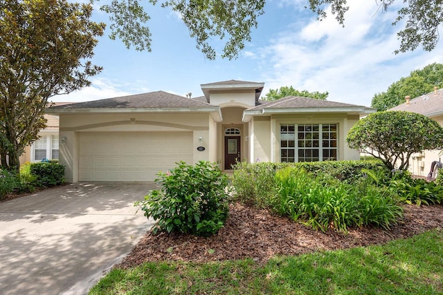 902 Heron Point Cir, Deland, FL 32724 - view of front of house with an attached garage, stucco siding, and concrete driveway