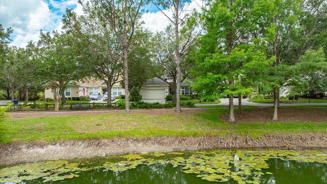 902 Heron Point Cir, Deland, FL 32724 - view of community featuring a garage and a water view