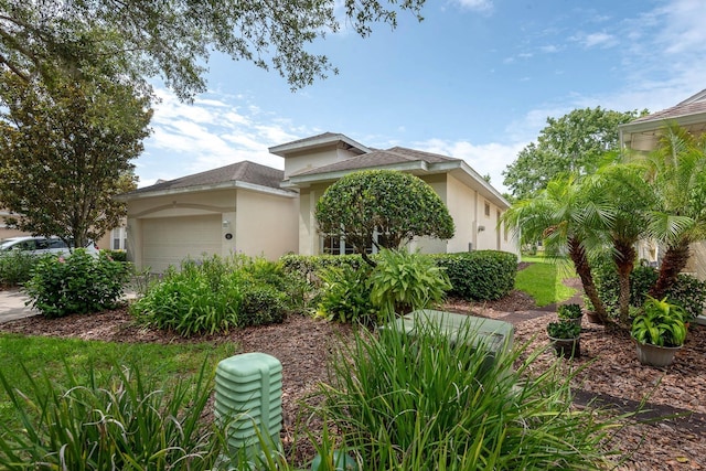 902 Heron Point Cir, Deland, FL 32724 - view of front of house featuring stucco siding and an attached garage