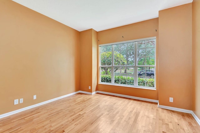 902 Heron Point Cir, Deland, FL 32724 - spare room with baseboards and wood finished floors