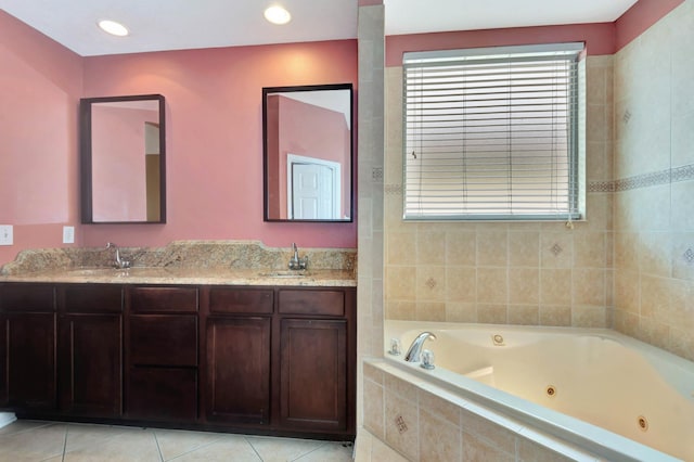 902 Heron Point Cir, Deland, FL 32724 - bathroom featuring a tub with jets, double vanity, tile patterned floors, and recessed lighting