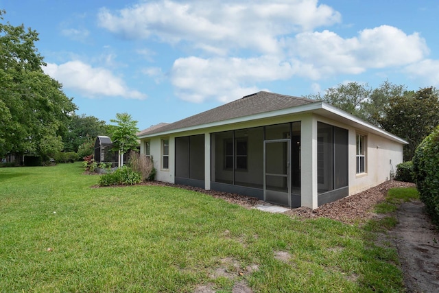 902 Heron Point Cir, Deland, FL 32724 - back of house featuring a sunroom, a lawn, and stucco siding