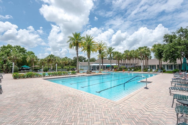 902 Heron Point Cir, Deland, FL 32724 - community pool featuring a patio area