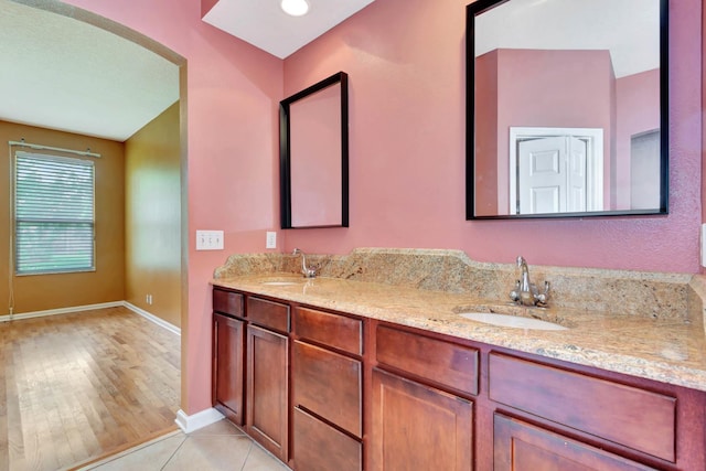 902 Heron Point Cir, Deland, FL 32724 - bathroom featuring double vanity and baseboards