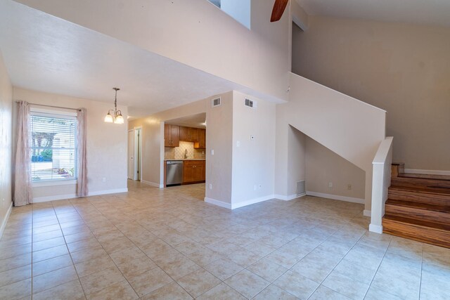 4602 Sandcastle Cir, Saint Augustine, FL 32084 - unfurnished room with baseboards, light tile patterned floors, and a notable chandelier