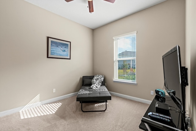 sitting room featuring carpet flooring and ceiling fan