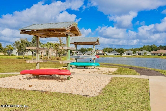 view of home's community featuring a gazebo, a yard, and a water view