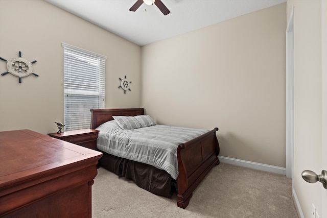 bedroom with ceiling fan and light colored carpet