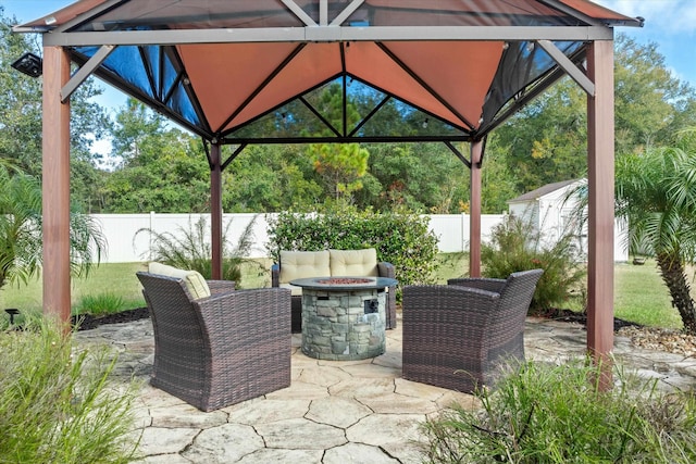 view of patio with a gazebo and a fire pit