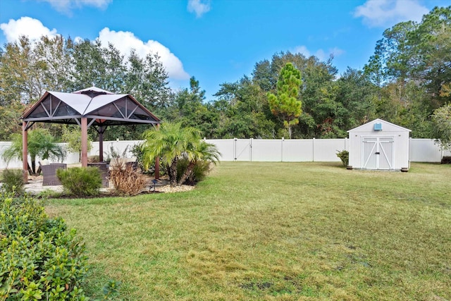 view of yard featuring a gazebo and a storage unit