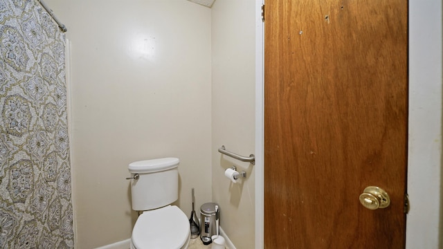 11519 W Confederate Dr, Glen Saint Mary, FL 32040 - bathroom featuring a shower with curtain and toilet