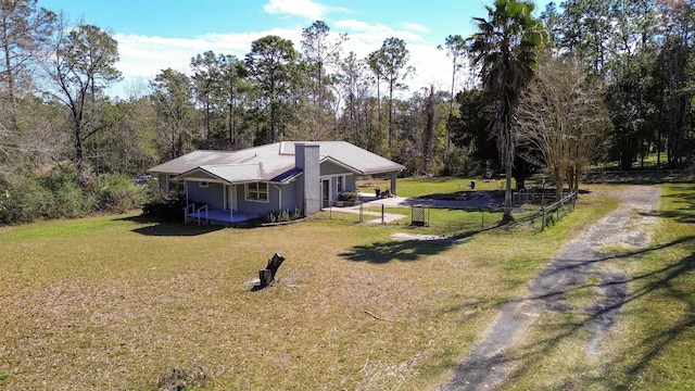 11519 W Confederate Dr, Glen Saint Mary, FL 32040 - exterior space with driveway, a front yard, and fence