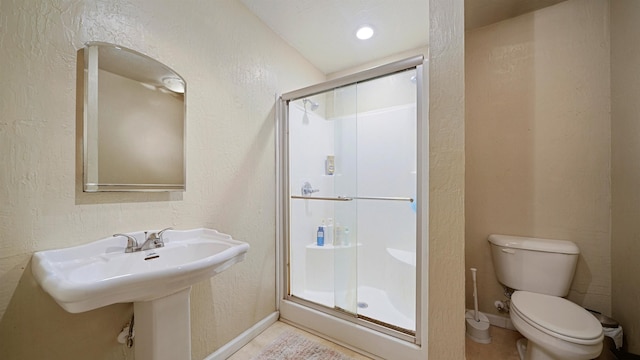 11519 W Confederate Dr, Glen Saint Mary, FL 32040 - full bathroom with baseboards, toilet, a shower stall, and a textured wall