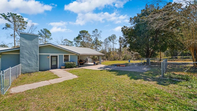 11519 W Confederate Dr, Glen Saint Mary, FL 32040 - view of yard featuring an attached carport, a patio, and a fenced backyard