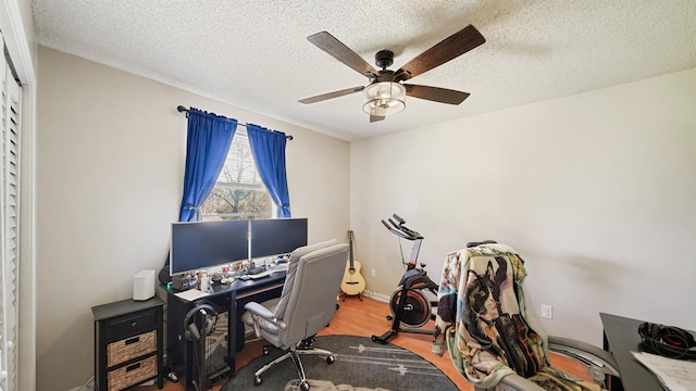 11519 W Confederate Dr, Glen Saint Mary, FL 32040 - office space with wood finished floors, a ceiling fan, baseboards, and a textured ceiling