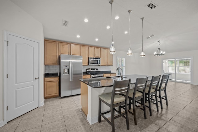 kitchen with visible vents, appliances with stainless steel finishes, and a sink