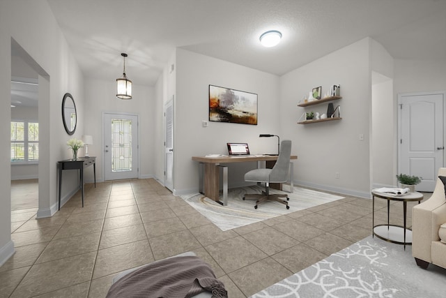 tiled entrance foyer with baseboards