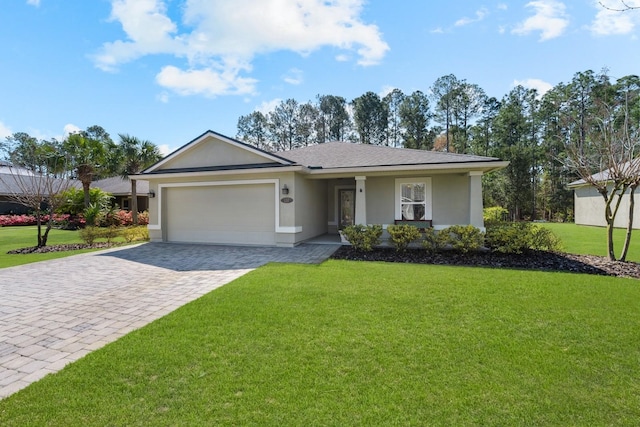 137 Cereus Ln, Saint Augustine, FL 32086 - single story home featuring decorative driveway, an attached garage, a front lawn, a chimney, and stucco siding